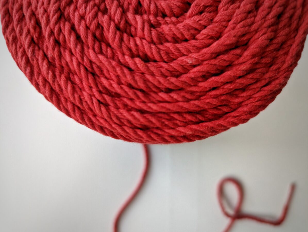 Three-ply cotton cord. Bright red